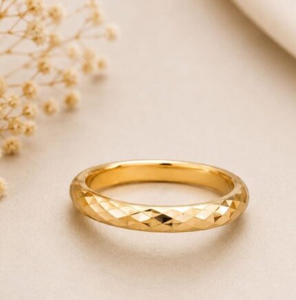 A luxury 21K gold band ring with a sparkling diamond-cut texture, perfect for daily wear