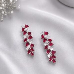 Silver 925 pink floral pendant with matching stud earrings featuring sparkling stones on a luxury silver background.