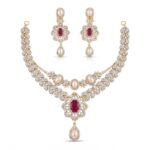 A pair of handcrafted 925 sterling silver earrings featuring central red stones, sparkling synthetic cubic zirconia, and hanging pearls on a clean white background.
