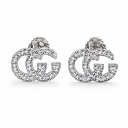 Sparkling silver monogram stud earrings with intertwined GG-inspired design