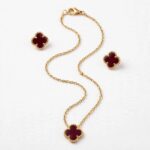 pure silver clover pendant set with burgundy stone