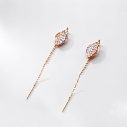Pair of rose gold leaf shaped sui dhaga chain threader earrings with white zircon stones