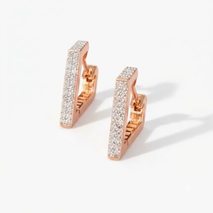 Pair of rose gold J shape huggie bali earrings with full white zircon pave setting